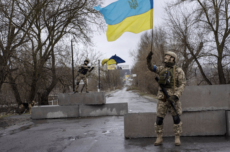 Ukrainian Soldier waving the Ukraine flag